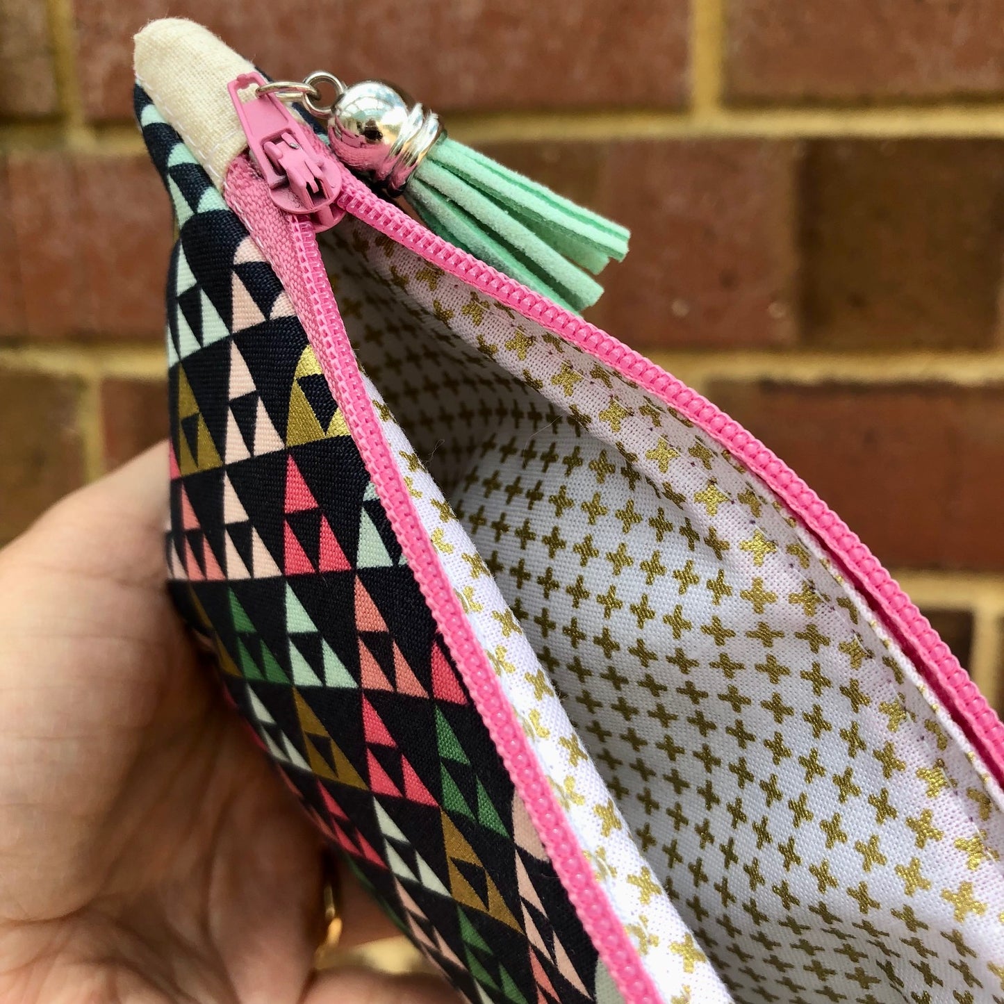 Gold Metallic Triangles lined zipper pouch with tassel