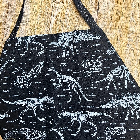 Glow-in-the-dark dinosaur adjustable apron with pockets