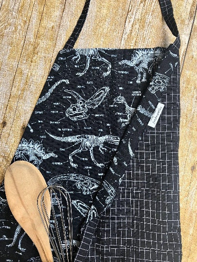 Glow-in-the-dark dinosaur adjustable apron with pockets